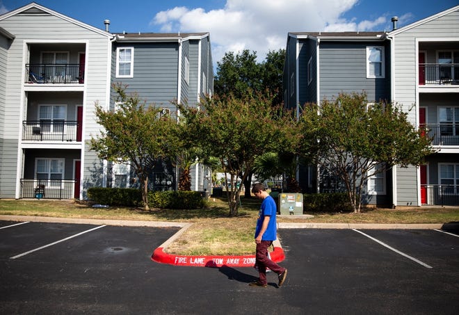 Jessy Beauchamp, 29, walks last week to a friend's apartment at the Quad apartment complex, which could be bulldozed for a large redevelopment project. On Thursday, the Austin City Council gave preliminary approval to the project. [ELI IMADALI/AMERICAN-STATESMAN]