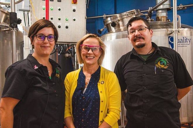 Sen. Maria Collett, D-12, Lower Gwynedd, center, is joined by the co-owners of Tannery Run Brew Works, Carly Chelder, left, and Timothy N. Brown, during her visit to the Ambler brewery on July 15. Tannery Run hosted Collett as the latest Brewer for a Day. Organized by the Brewers of Pennsylvania, the state’s official beer guild, Brewer for a Day is an initiative designed to give state legislators a hands-on, insider’s perspective on the brewing process, as well as further educate Pennsylvania senators and representatives on the direct economic impact craft brewers have on communities throughout the state. [CONTRIBUTED]