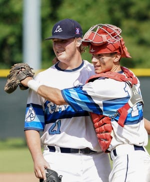 Pitcher Stephen Kalinick celebrates with catcher Ryan Proto after Team Cape Cod beat Onondaga, N.Y., 5-4 Thursday afternoon in the Babe Ruth World Series quarterfinals in Mobile, Ala. [Courtesy of Adam Proto]