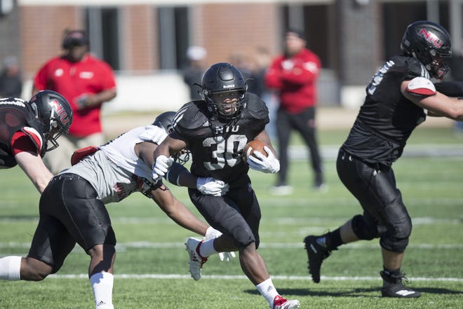 Former Lena-Winslow star Rahveon Valentine bursts through a hole during the Northern Illinois Huskies' offseason workouts. Valentine is one of several running backs vying for touches headed into the first season under head coach Thomas Hammock. [PHOTO PROVIDED BY NIU]