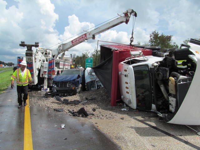 Authorities say a man and an infant were fatally injured when a dump truck crashed into eight other vehicles on I-75.