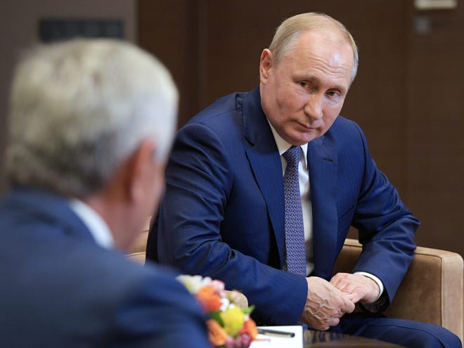 A Vox caller hopes karma deals Russian President Vladimir Putin, right, a dose of payback. [Alexei Druzhinin, Sputnik, Kremlin Pool Photo via AP]