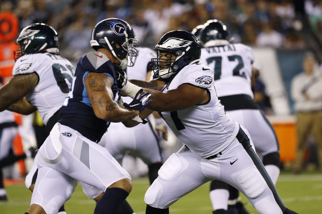 Eagles rookie tackle Andre Dillard blocks the Titans' Kamalei Correa during Thursday night's preseason game. [MICHAEL PEREZ / ASSOCIATED PRESS]