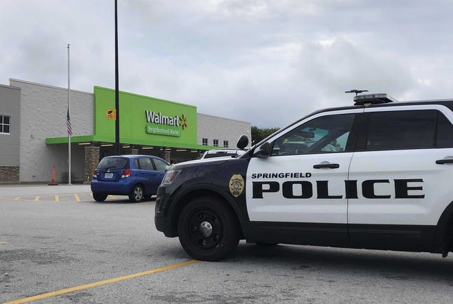 Springfield police respond to a Walmart on Thursday afternoon in Springfield after reports of a man with a weapon in the store. Police say they have arrested an armed man who showed up the store wearing body armor, sending panicked shoppers fleeing the store. (Harrison Keegan/The Springfield News-Leader via AP)