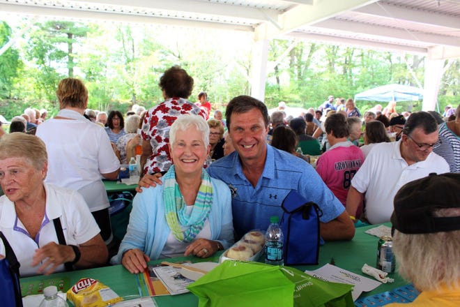 Sheriff Lew Evangelidis with a senior at last year's picnic in Shrewsbury. [Submitted photo]