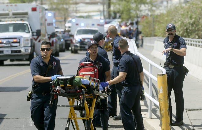 El Paso paramedics arrive at the scene of a shooting at a Walmart near the Cielo Vista Mall in El Paso, Texas, on Aug. 3. [MARK LAMBIE/EL PASO TIMES VIA AP]