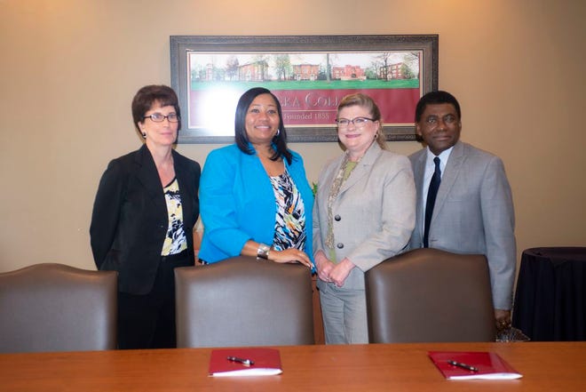 From left to right, Eureka College Provost Dr. Ann Fulop, Eureka College President Dr. Jamel Santa Cruze Wright, ICC President Dr. Sheila Quirk-Bailey, and ICC Vice President of Academic Affairs Dr. Emmanuel Awuah prepare to make the partnership between their institutions official during a signing ceremony at Eureka College. PHOTO COURTESY OF ILLINOIS CENTRAL COLLEGE