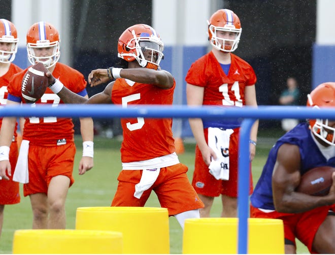 Florida quarterback Emory Jones throws the ball in a drill during a preseason practice at the Sanders Practice Fields on campus. [Brad McClenny/Staff photographer]