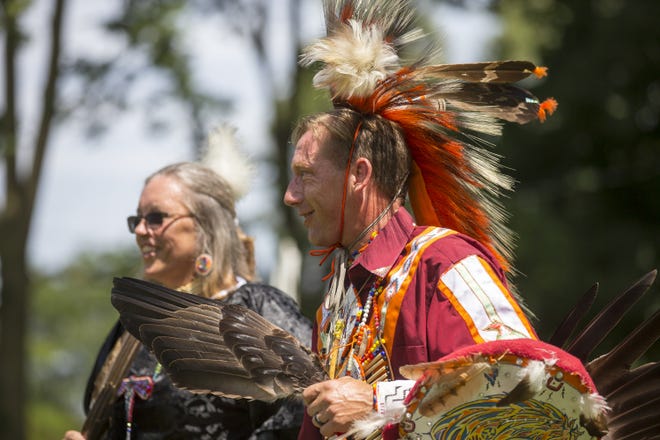 Jannette and Daniel Reese, dancers from Bull Valley Singers, participate in the Honoring the Mounds Gathering on Saturday, Aug. 10, 2019, at Beattie Park in Rockford. The event promotes awareness of the burial mounds at Beattie Park. [SCOTT P. YATES/RRSTAR.COM STAFF]