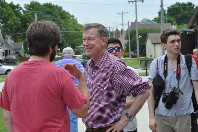 Presidential candidate John Hickenlooper talks to a voter in Ankeny, Iowa. In his speech that day, he said, “I’m running for president because I view this country as being in the middle of a crisis of division. I don’t think we’ve been this divided since the Civil War.” [Bob Beatty/Special to The Capital-Journal]