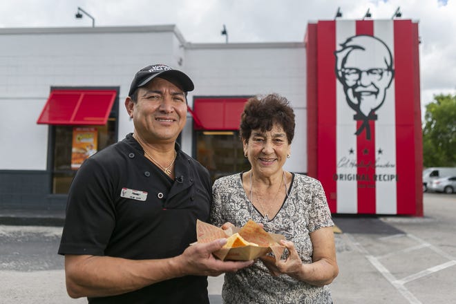 Frank Turcios, 54, and Blanca Rosa Ortiz, 72, both employees at Kentucky Fried Chicken, hold one of the flans they make daily from their restaurant in Hialeah, Fla. on July 24, 2019. (Matias J. Ocner/Miami Herald/TNS)
