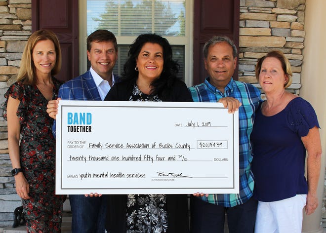 From left, Heidi Hubert, Jeff Perkins, Dina Della Ducata, Family Service CEO, and Cliff and Linda Davis during a check presentation held at Family Services' Langhorne office. [CONTRIBUTED]