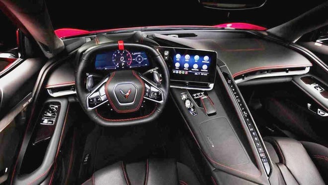 The C8 Stingray interior features a squared off steering wheel with a center top "red tape" marker to let the driver know when the wheels are pointed straight. Notice the aircraft like buttons that ride down in a single column arrangement. [Chevrolet Corvette Division]