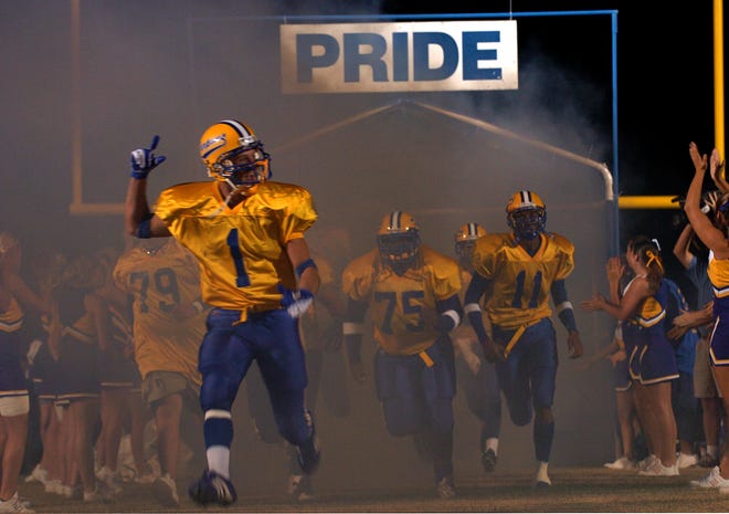 Charlotte High School makes a return to its home field on Friday, October 22, 2004 in Punta Gorda, two months after it was destroyed by Hurricane Charley. The "Pride" sign was one of the few things to withstand the storm. {Herald-Tribune staff photo}