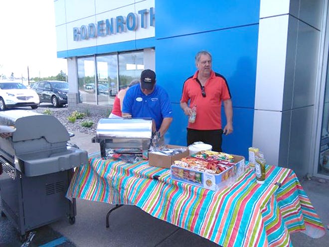 Steve Rodenroth manned the grill, serving up burgers and hotdogs to hungry community members. (Tami Miller/The Sault News)