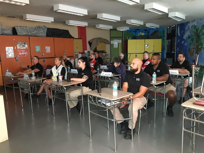 Members of the Fall River Public Schools’ security team listen during a recent class during a training session administered by the Bristol County Sheriff’s Office’s Department of Homeland Security. [Photo courtesy of the Bristol County Sheriff’s Office]