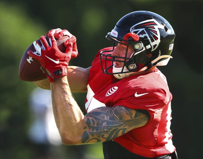 Atlanta Falcons tight end Eric Saubert catches a pass during training camp July 24 in Flowery Branch. [CURTIS COMPTON/ATLANTA JOURNAL-CONSTITUTION VIA AP]