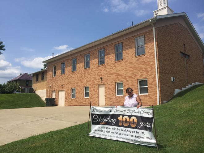 Times-Reporter Jon Baker

Rhonda Lowery, a member of Mount Olive Missionary Baptist Church in Dennison, stands in front of the building on S. Seventh St. The church is celebrating its 100th anniversary this year.
