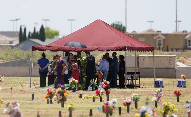 Family and friends gather for a funeral service for Jordan Anchondo at Evergreen Cemetery in El Paso, Texas on Saturday, Aug. 10, 2019.  Andre and Jordan Anchondo, were among the several people killed last Saturday, when a gunman opened fire inside a Walmart packed with shoppers. Authorities say Jordan Anchondo was shielding the baby, while her husband shielded them both. [ JORGE SALGADO / AP ]