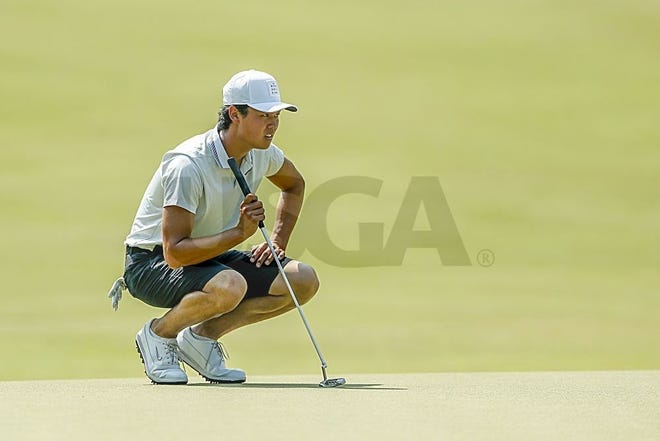 Brandon Wu studies a putt at the Pinehurst Resort during the second round of the U.S. Amateur. Wu is the leader in the clubhouse of the suspended second round. [Provided by the United States Golf Association]