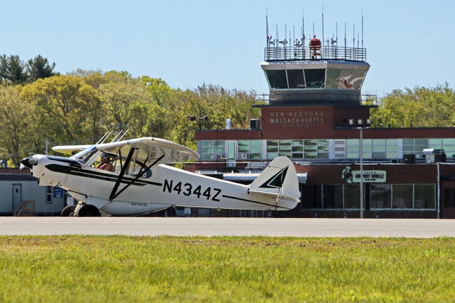 A small plane makes its way down the runway at the New Bedford Regional Airport, home of the Airport Grille, which is going under new ownership. [ PETER PEREIRA/THE STANDARD-TIMES/SCMG ]