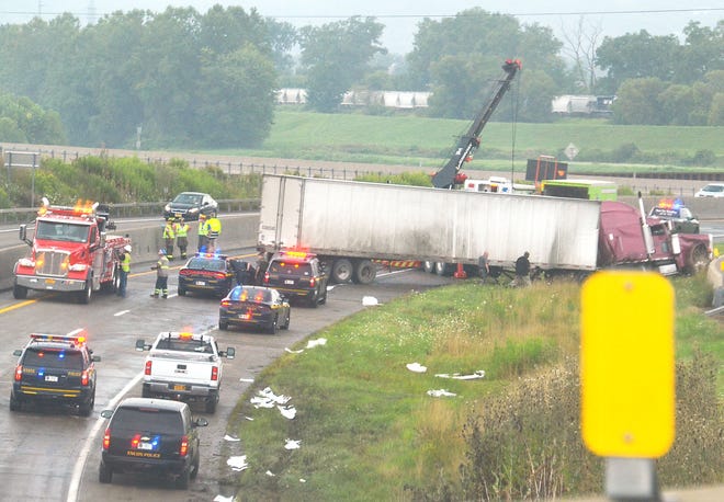 A tractor-trailer traveling westbound on Interstate 86 crashed near Exit 45 in Painted Post Tuesday afternoon. The New York State Police and other first responders temporarily closed both lanes while tending to the accident. [Stephen Borgna/The Leader]
