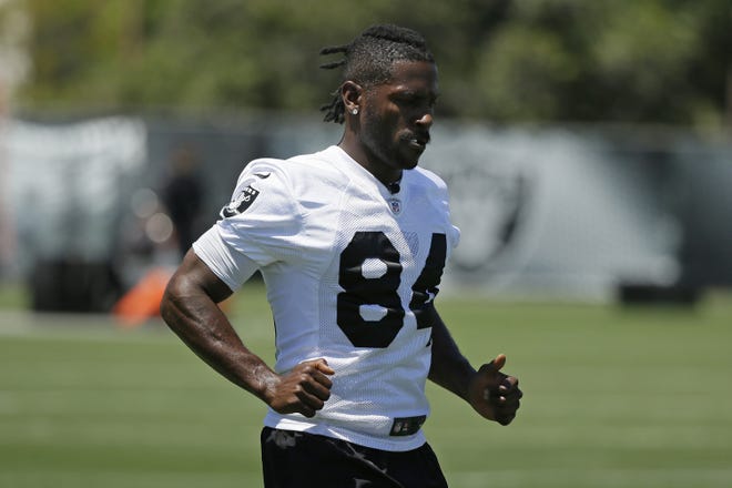 Antonio Brown returned to the Oakland Raiders' training camp facility Tuesday after missing time to see a specialist for his frost-bitten feet and losing a grievance with the NFL over the use of a helmet. [ERIC RISBERG/THE ASSOCIATED PRESS]