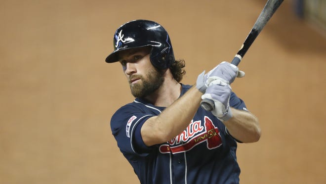 The Atlanta Braves' Charlie Culberson warms up before batting during the first inning of a game against the Miami Marlins on Aug. 11, 2019 in Miami. The Braves are scheduled to host the Mets on Wednesday. [WILFREDO LEE/THE ASSOCIATED PRESS]