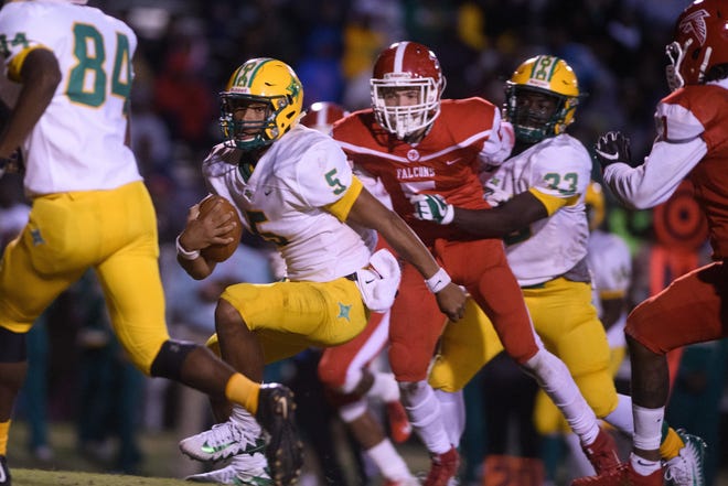 Richmond Senior quarterback Caleb Hood (5) completed 129 of 222 passes as a sophomore last year for 1,956 yards and 21 touchdowns with just three picks as the Raiders went 7-0 in league play. [Andrew Craft/The Fayetteville Observer File Photo]
