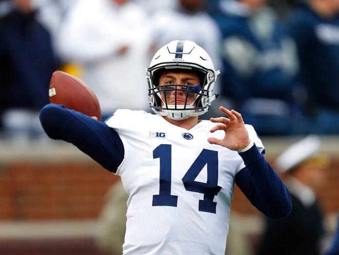 From Nov. 3, 2018, Penn State quarterback Sean Clifford (14) warms up before an NCAA football game against Michigan in Ann Arbor, Mich. Clifford always planned to be Penn State's starting quarterback. The opportunity came sooner than even he expected. Clifford has huge task in replacing Trace McSorley, but he sounds and looks the part. (AP Photo/Paul Sancya, File)
