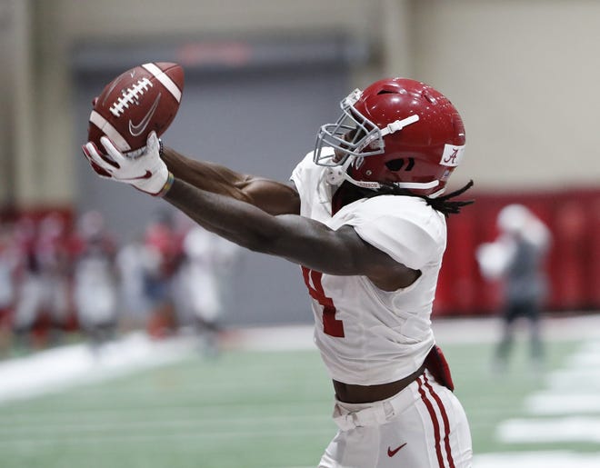 Alabama wide receiver Jerry Jeudy hauls in a catch during Tuesday's practice at the Hank Crisp Indoor Practice Facility. [Alabama Athletics]