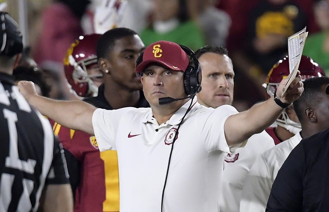 Southern California head coach Clay Helton went 21-6 with a Rose Bowl victory and Pac-12 title in his first two full seasons as USC coach, but his job status is one of the stories of the 2019 season. [Associated Press]