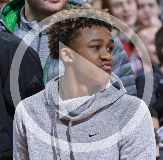In this file photo Meechie Johnson Jr. attends an Ohio State basketball game against Iowa on Feb. 10, 2018, in Value City Arena.