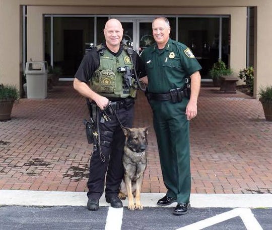 Retired Sarasota County Sheriff's Deputy Paul Fern, left, K9 Eros, and Sheriff Tom Knight after he retired from the agency in 2018. [COURTESY OF THE SARASOTA COUNTY SHERIFF'S OFFICE]