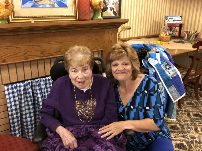 Mary Jo Sanner (right) of New Philadelphia was so moved when her mother, June Schrump (left), 89, of Strasburg, was diagnosed with Alzheimer’s, she decided to jot down her thoughts and pen a book. (TimesReporter.com / Barb Limbacher)