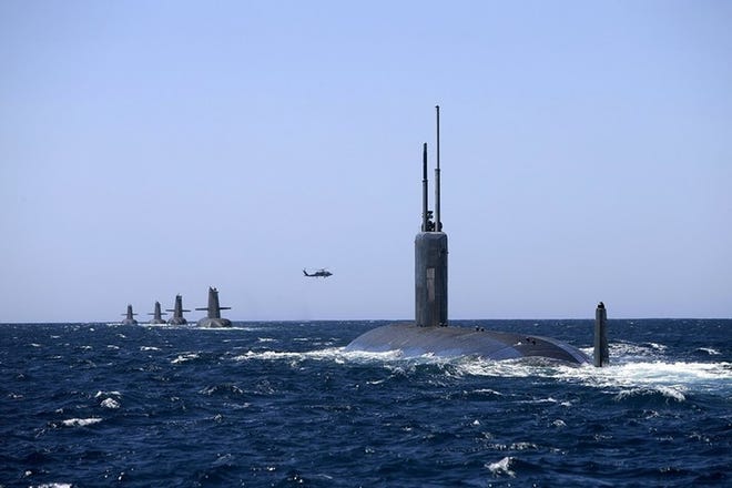 USS Santa Fe, front, arrives for a port call in Stirling, Australia, during the nuclear-powered attack submarine’s recently completed Pacific deployment. Santa Fe arrived Thursday for planned maintenance at Portsmouth Naval Shipyard. [Courtesy photo by LSIS Richard Cordell via US Navy, file]