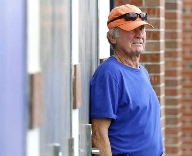 Florida football legend Steve Spurrier watches practice from a distance at the Sanders Practice Fields on campus. [Brad McClenny/Staff photographer]