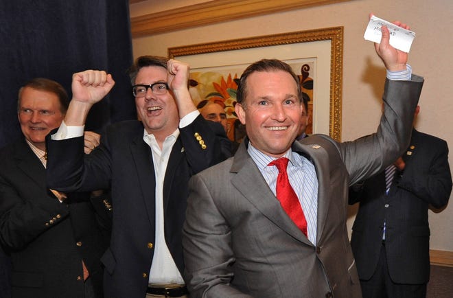 In this March 24, 2015 file photo, Brian Hughes, left, and then-candidate for mayor Lenny Curry celebrate election results. At the time, Hughes was Curry's spokesman. [Bob Mack, The Florida Times-Union]
