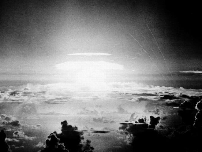 The fireball of a hydrogen bomb lights the Pacific sky a few seconds after the bomb was released over Bikini Atoll on May 21, 1956. A Texas-based company is facing criticism for naming a beer after the location of nuclear tests that resulted in the contamination of a Pacific island chain, a report said. [ASSOCIATED PRESS FILE PHOTO]