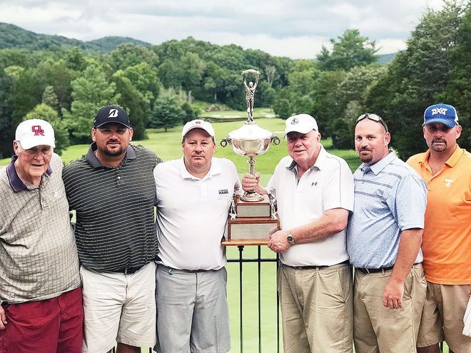 PRESENTING THE WOODY TROPHY — Johnny Woody presents the Woody Trophy to his son, Jimmy Woody, a member of the Championship Flight winning team. The Woody family founded the Lawrence Hahn Boys & Girls Club of Oak Ridge Golf Tournament in 1981. Pictured from left are Lawrence Hahn, Jonathan Mount, Jimmy and Johnny Woody, Patrick McKenzie and Eric Nolan.