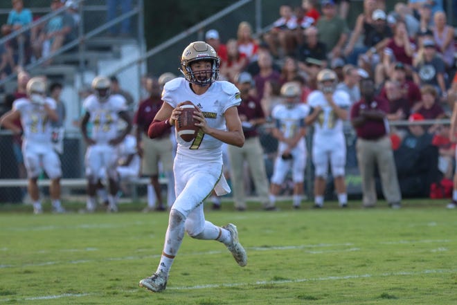 St. Augustine quarterback Sammy Edwards looks downfield for Michael Early during the second quarter of an Aug. 24, 2018 win over Baker County. Edwards thew for 92 yards and two touchdowns in his first varsity start. [Will Brown/The Record]