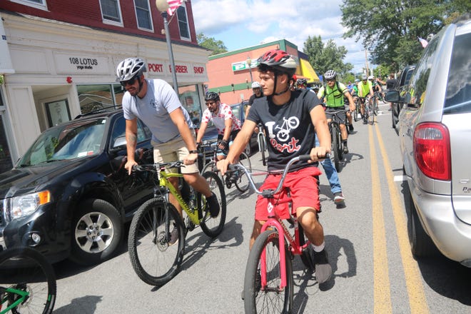 A crowd biked from Action Bikes and Outdoor in Milford to the new store in Port Jervis. [Jessica Cohen/For the Gazette]
