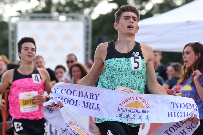 Tyler Brogan (5) led a fast boys high school mile in Falmouth with a winning time of 4:21.62, as three runners bested Garrett O'Toole's previous race record of 4:25.46, set in 2012. Michael Griffin (4:22.16) and Shane Grant (4:23.1) were second and third, respectively. Photos by Paul Drake