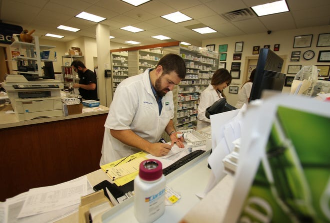 Joe Giangiacomo bought Rock Hill Pharmacy about three months ago. He envisioned a more hands-on approach as the future of pharmacy but said that is hard to do because of all the other things a pharmacist must now contend with. [JIM SABASTIAN/FOR THE TIMES HERALD-RECORD]