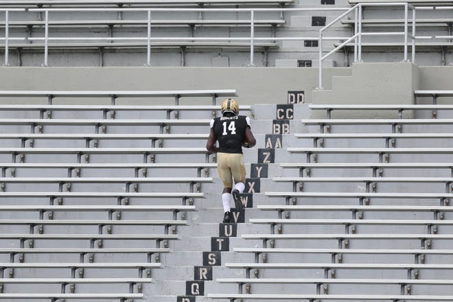 Black Knights wide receiver Michael Roberts penitently climbs the Michie Stadium steps after losing a fumble. [PHOTOS BY EDWARD DILLER/FOR THE TIMES HERALD-RECORD]