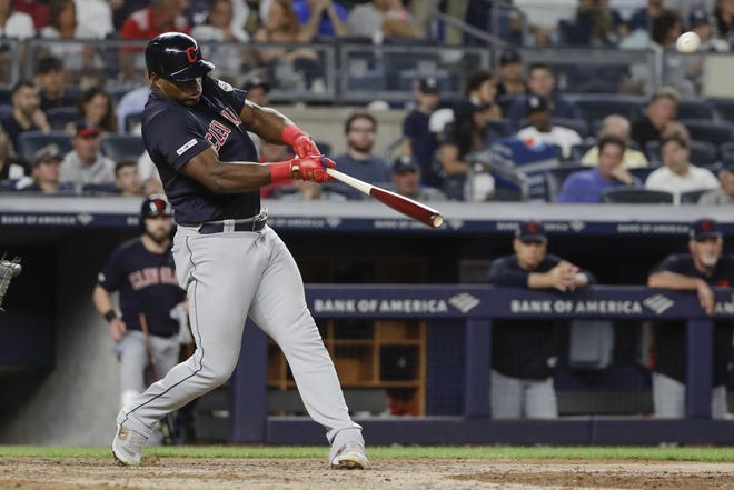 Cleveland Indians' Yasiel Puig hits a home run during the seventh inning of a baseball game against the New York Yankees, Friday, Aug. 16, in New York. (AP Photo/Frank Franklin II)