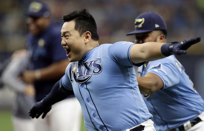 Tampa Bay Rays' Ji-Man Choi celebrates his two-run walk-off single off Detroit Tigers relief pitcher Joe Jimenez during the ninth inning Sunday in St. Petersburg. [The Associated Press / Chris O'Meara]