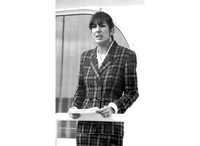In this Nov. 7, 1991, file photo Ghislaine Maxwell, daughter of late British publisher Robert Maxwell, reads a statement in Spanish in which she expressed her family's gratitude to the Spanish authorities, aboard the "Lady Ghislaine" in Santa Cruz de Tenerife. Ghislaine is one of the most prominent figures left from the orbit of Jeffrey Epstein after his suicide in jail while awaiting trial on sex trafficking charges. (