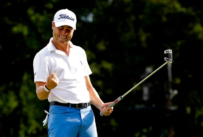 Justin Thomas celebrates after making a birdie on the 18th green during the final round at the BMW Championship golf tournament at Medinah Country Club, Sunday, Aug. 18, 2019, in Medinah, Ill. (AP Photo/Nam Y. Huh)