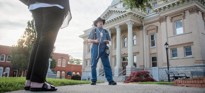 Russ Giles as Thomas 'Pink' Bowman sports a noose and carries a lantern during a dress rehearsal for the initial Ghostwalk. This year will mark the third year of the event. [Paul Church / The Courier-Tribune]